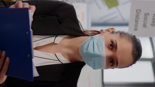 Vertical Video Business Woman with Face Mask During Online Web Internet Videocall alt