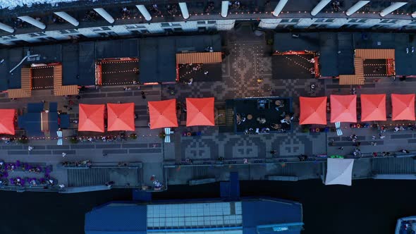 People in Open Space in Summer Cafes During the Easing of Quarantine Restrictions  Top Aerial View alt