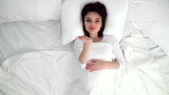 Air Kiss. Woman Sending Air Kiss And Showing Heart At Camera alt