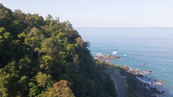Coastal road running along the stunning beaches near Jaco in Costa Rica. Wide angle aerial shot alt