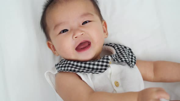 happy baby newborn on a bed
