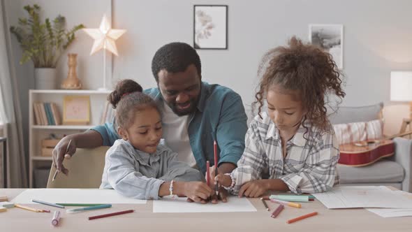 Two Girls Spending Time with Dad at Home alt