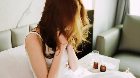 Nose stuffy, sneezes and coughs. Blows nose and hides under covers. alt