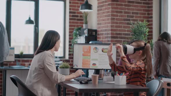 People Talking About Business Project While Child Using Vr Glasses alt