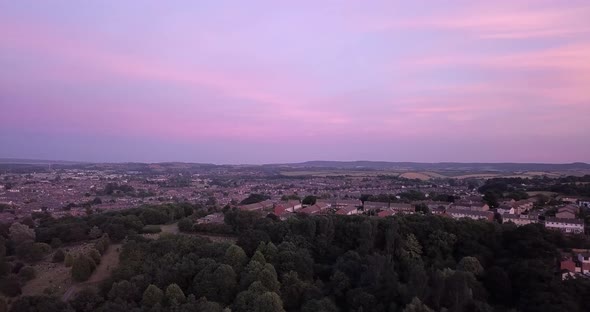 And aerial view of Exeter with blue skys panning from left to right. alt