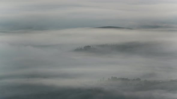 Time lapse of the fog over the valley in Tuscany, Italy
