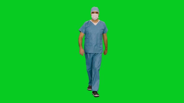 Male Doctor Surgeon In Mask And Uniform Walking Confident on Green Screen