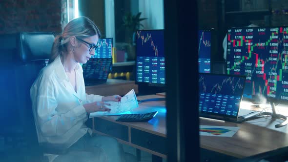 Female Trader is Calculating Realtime Stock Data alt