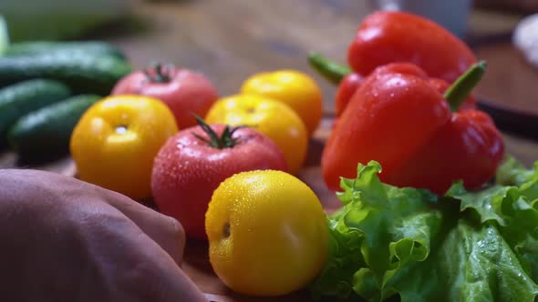 Spread Tomatoescucumberslettuce and Sweet Pepper on Wooden Round Cutting Board alt