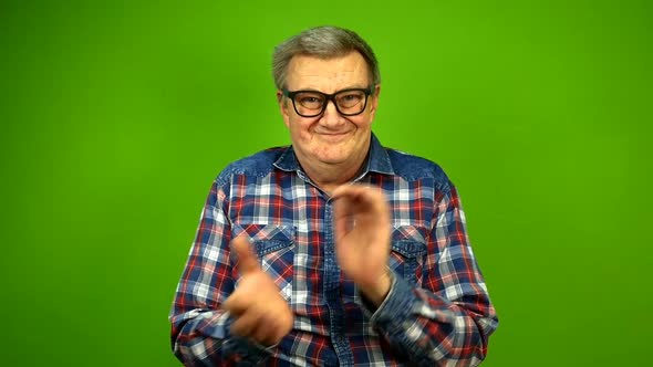 Mature Adult Strange Man in Stupid Glasses is Emotionally Claps His Hands alt