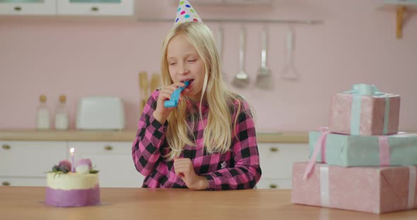 Pretty Little Girl Celebrating Birthday Sitting Alone at Home. Birthday Girl Making a Wish and alt
