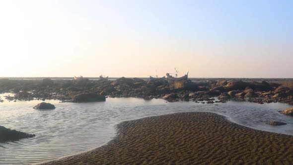 View of the sandy beach and the sea in the Bay of Bengal , traditional wooden boat in Saint Martin' alt