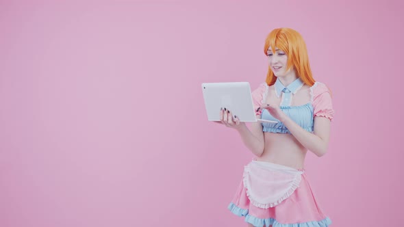 CuteLooking Teenager Chatting With Someone Using Her Brand New White Laptop Medium Long Studio Shot alt