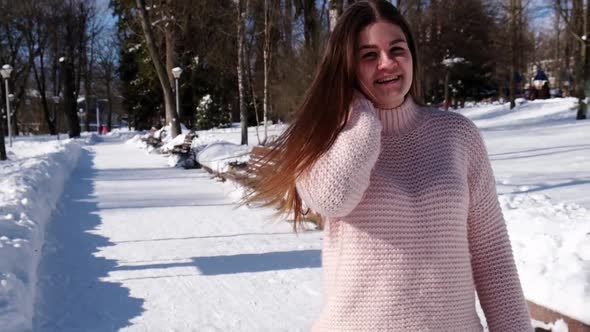 Beautiful Young Woman in Knitted Sweater in Winter Park alt