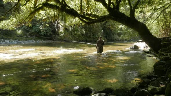 fly fishing  a lush spring creek in new zealand alt