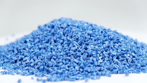 granule made of polypropylene, Blue Plastic pellets crumbles to the table