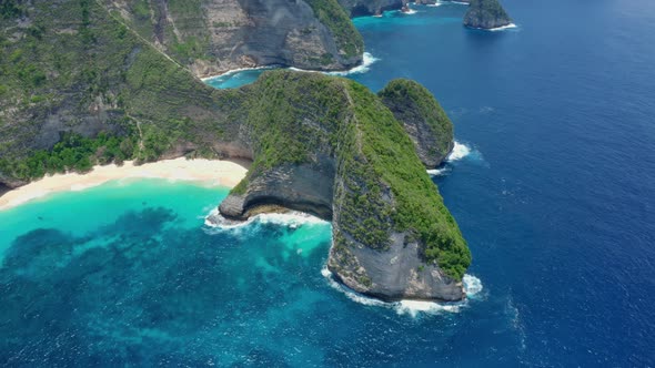 Aerial View of Mesmerizing Scenic Kelingking Beach with a Sheer Cliff  alt
