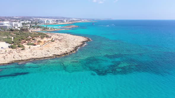 City with Multistory Buildings Against Mountains at Dawn