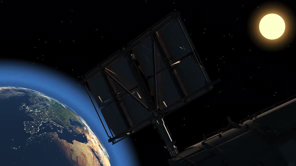 A space communications satellite flies over the earth.