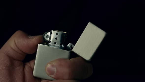 Super Slow Motion Shot of Igniting Metallic Lighter at 1000Fps. alt