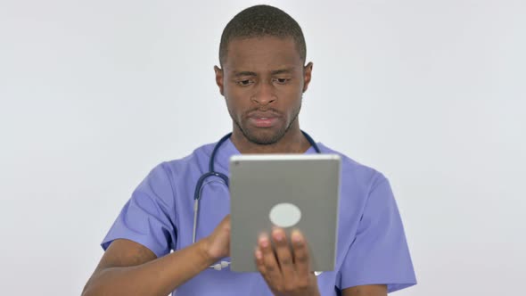 African Doctor Using Digital Tablet on White Background alt