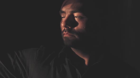 Portrait of a Man in a Black Shirt