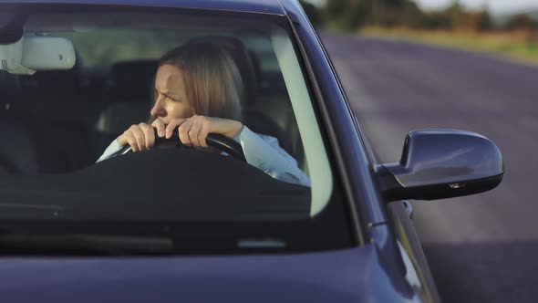 Tired Woman in Car
