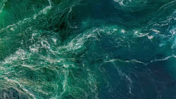Waves of Water of the River and the Sea Meet Each Other During High Tide and Low Tide alt