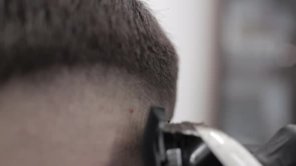 Haircut with Electric Razor. Men's Haircuts. Slow Motion. alt
