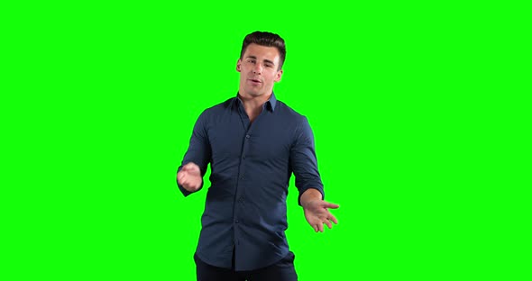 a Caucasian man talking in a green background
