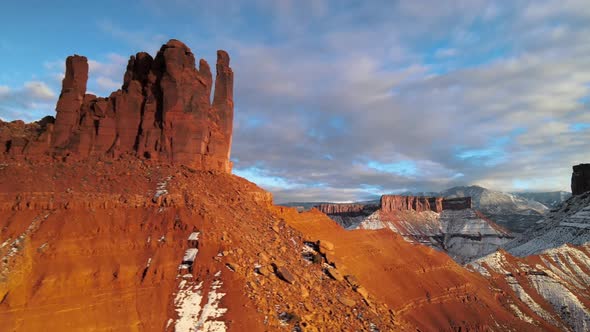 Sunset aerial panning shot of sandstone towers near Moab, Utah, in wintertime. alt