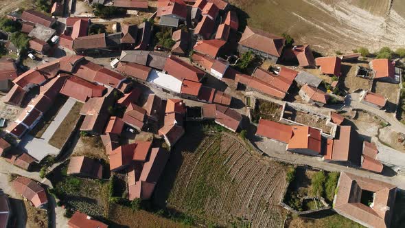 Aerial view of the village, lake, fields and forest in mountains alt