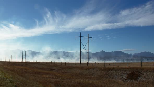 Smoke from fire by the powerlines wide alt