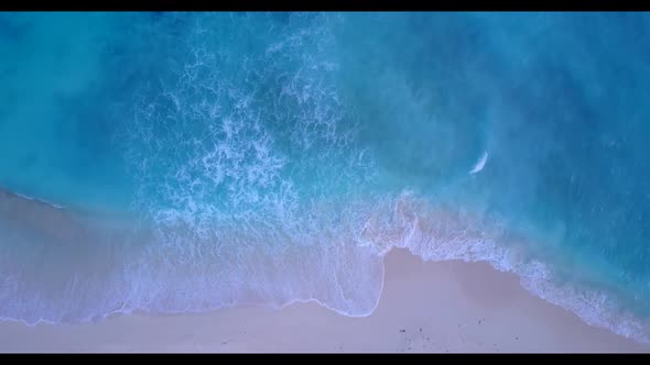 Aerial panorama of marine shore beach trip by blue ocean and white sandy background of a dayout near alt