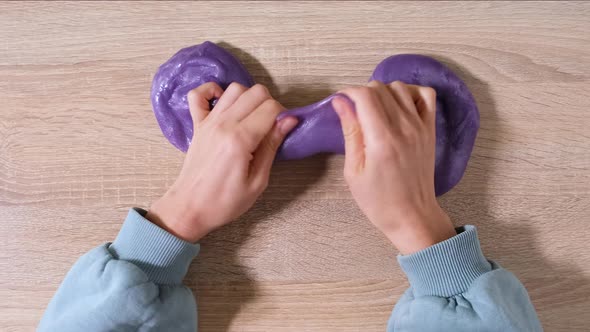 Playing with Slime Stretching the Gooey Substance for Fun and Stress Relief