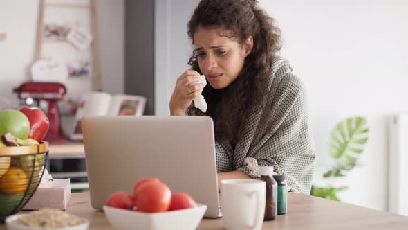 Tracking video of sick woman while video conference at home. Shot with RED helium camera in 8K. alt