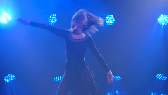 Young Beautiful Woman Dancing a Modern, Contemporary Ballet or Contemp Dance in a Dark Studio with alt