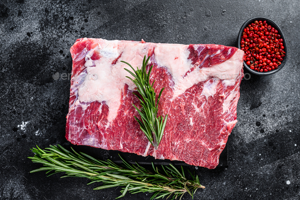 Raw beef short ribs kalbi on marble board. Black background. Top view ...