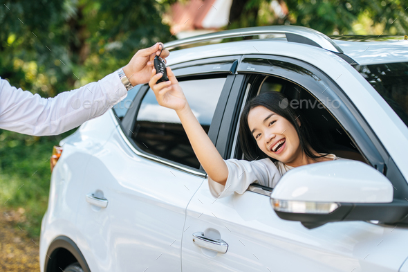 woman reaching for car keys - Stock Photo - Images