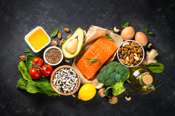 Healthy vegan food at black background top view - Stock Photo - Images