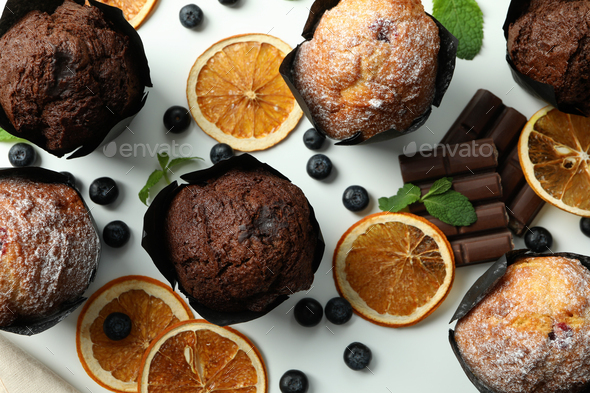 Concept of delicious food with chocolate muffins on white background - Stock Photo - Images