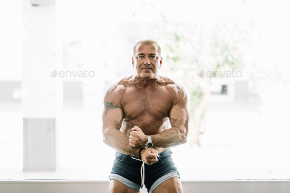 Muscular older man posing
