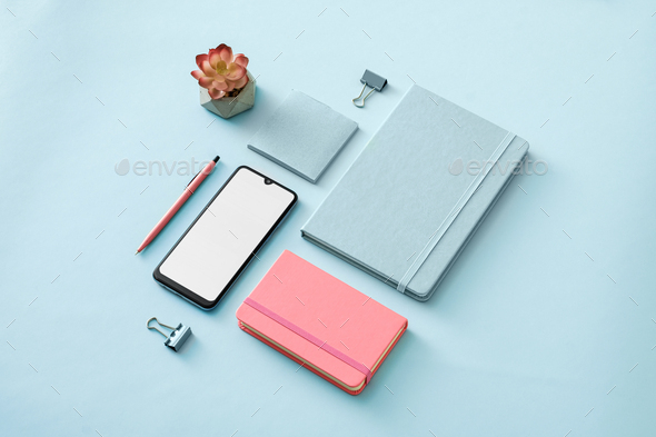 Neat color themed blue and pink office flt lay still life