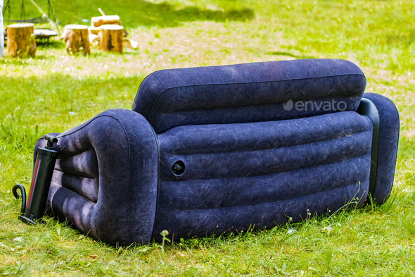 Inflatable sofa for outdoor recreation. Summer backyard party.