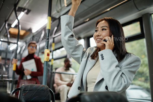 Smiling Asian Woman in Bus