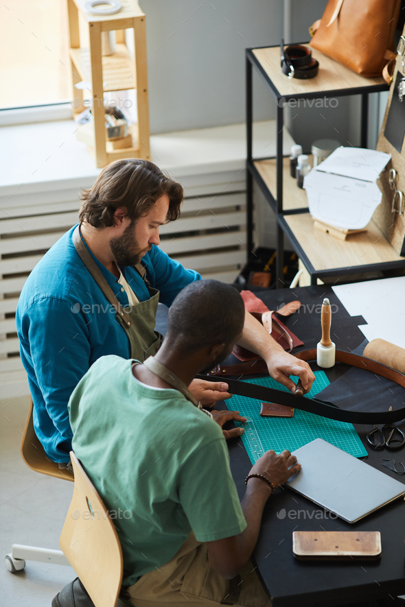 Apprenticeship in Leatherworking Shop Stock Photo by seventyfourimages