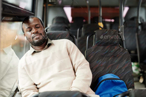 Man Sleeping on Bus