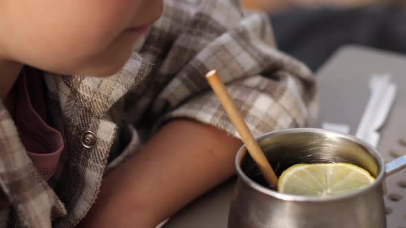 Girl Drinking Cold Lemonade