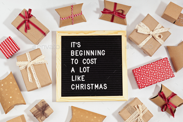Felt letter board with funny quote text It is beginning to cost a lot like Christmas