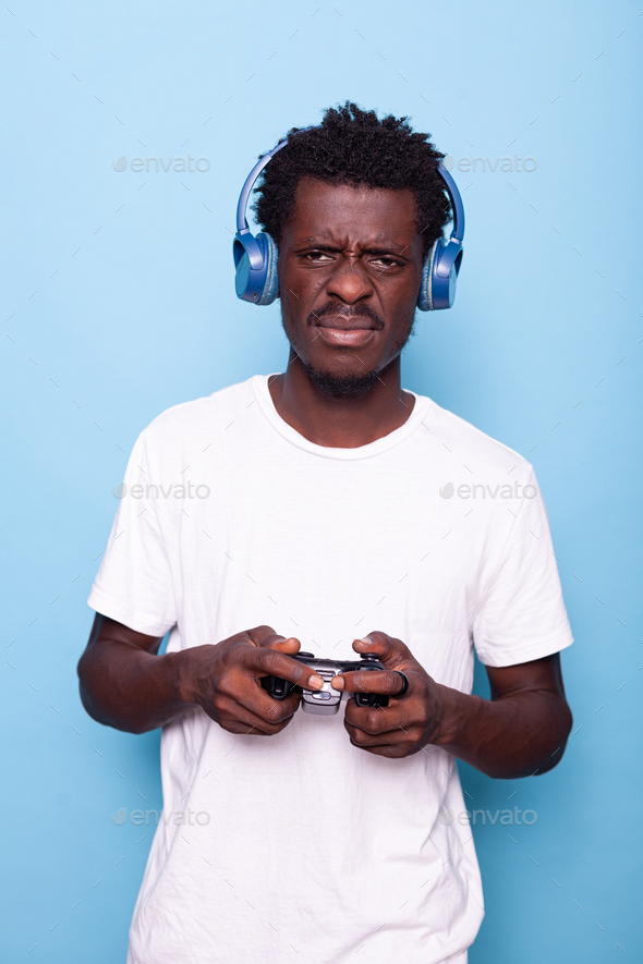 Young adult losing at video games with controller
